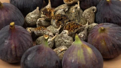 Ripe, raw figs and dried fruits of fig, healthy eating, slow motion Stock Footage 284647678