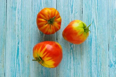 Ripe raw tomatoes on wooden background Stock Photos