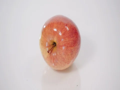 Ripe red and yellow apples, rotates on white background Stock Footage 73807882