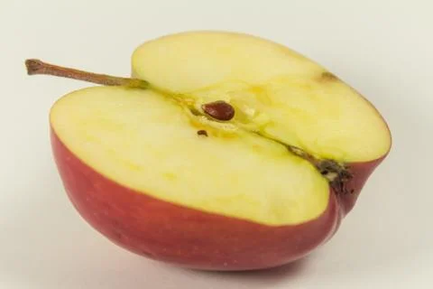 Ripe red apple half fruit isolated on white background. Half of red apple fru Stock Photos