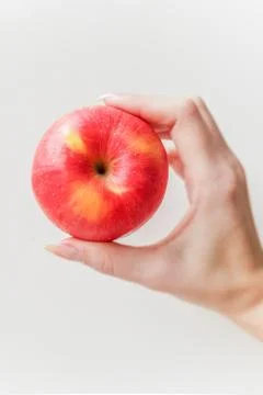 Ripe red apple in hand Stock Photos
