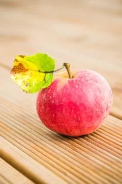 Ripe red apple with a leaf, close-up Stock Photos