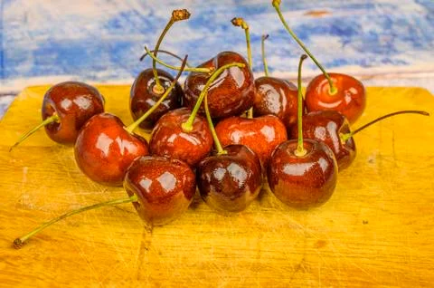 Ripe red cherries on the table close-up. Stock Photos