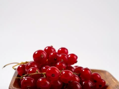 Ripe red currant on a light background. Stock Photos
