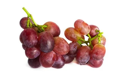 Ripe red grape with bunch isolated on white background. studio shot isolated. Stock Photos