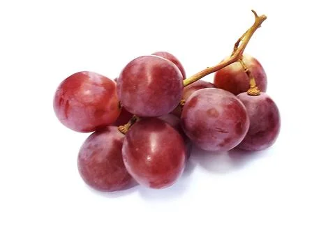 Ripe red grape fruit. bunch of red grape isolated on white. Stock Photos