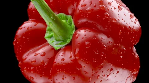 Ripe Red Pepper rotating on a black background. Fresh Vegetable Macro shot Stock Footage 149297079