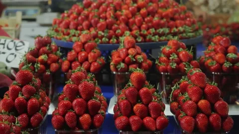 Ripe red strawberries are lying on the counter of the farmer's market, Healthy Video stock 221146876