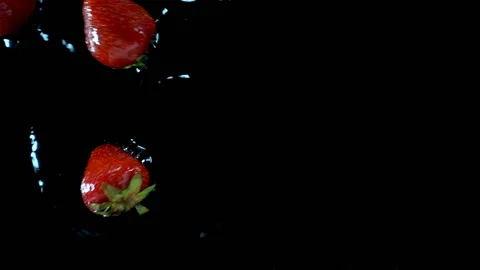 Ripe red strawberries fall in slow motion Stock Footage 197266537