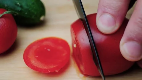 Ripe red tomato cut into circles Stock Footage 241019971