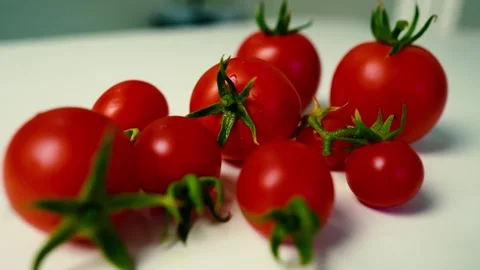 Ripe Red Tomatoes with Green Stems, A collection of ripe red tomatoes with .. Stock-Footage 304978640