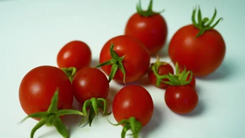 Ripe Red Tomatoes with Green Stems, A collection of ripe red tomatoes with .. 스톡 동영상 304978707