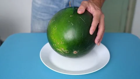 Ripe red watermelon cut in half with a knife Stock Footage 161650312