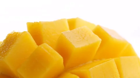 Ripe sliced mango squared rotation in 4k slow motion Stock-Footage 134304090
