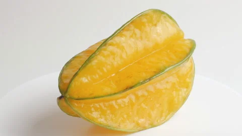 Ripe Star fruit with slice and  rotation Stock Footage 142657056