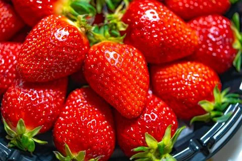 Ripe strawberries close-up as a texture background Stock Photos