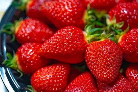 Ripe strawberries close-up as a texture background Stock Photos