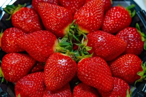 Ripe strawberries close-up as a texture background Stock Photos