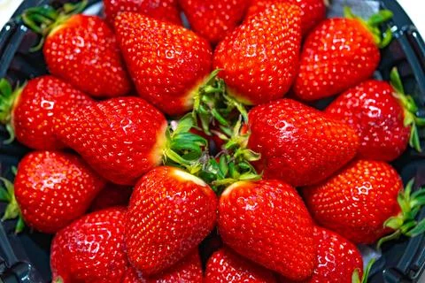 Ripe strawberries close-up as a texture background Stock Photos
