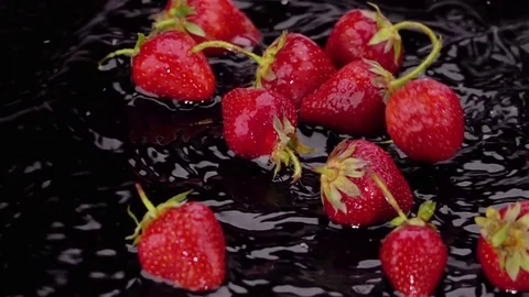 Ripe Strawberries Falls on the Table. Stock Footage 77973641