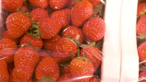Ripe strawberries in white plastic boxes close-up top view. Stock Footage 272554986
