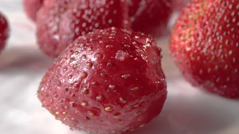 Ripe strawberries on a white surface close-up 스톡 동영상 132566948