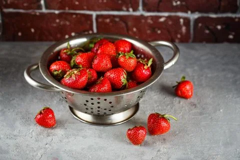 Ripe strawberry in colander Stock Photos