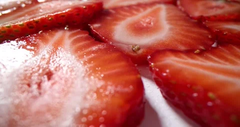 Ripe strawberry sliced halves pattern for dessert on tray Video stock 301074870