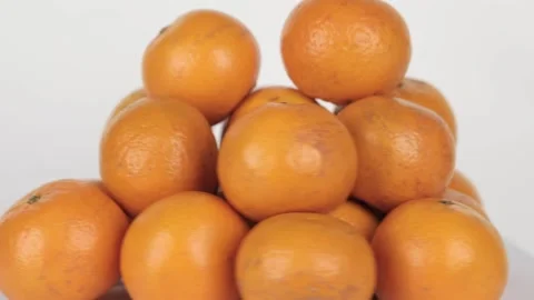 Ripe tangerines spin on a light background Stock-Footage 234652212