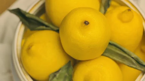 Ripe Thick Skinned Lemons Rotating In A Vase 스톡 동영상 99341570