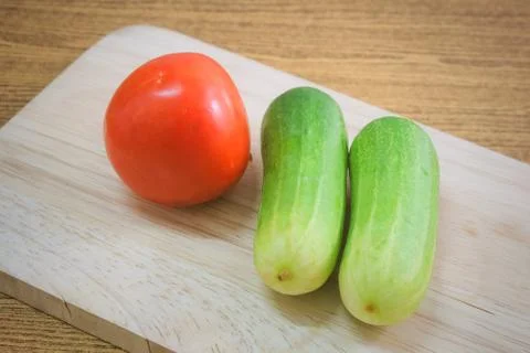 Ripe Tomato with Cucumbers Stock Photos