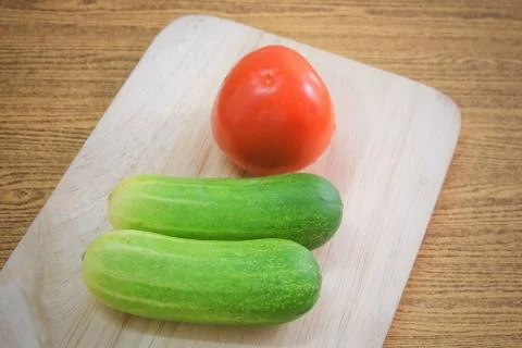 Ripe Tomato with Cucumbers Stock Photos