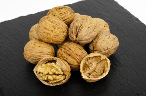 Ripe walnuts on black background. Studio Photo Stock Photos