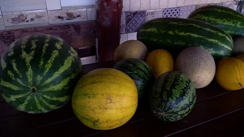 Ripe watermelons are on the table Видео 109603927