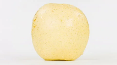 Ripe yellow apple on white background, close-up rotation. Stock Footage 63507773
