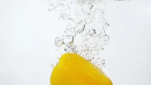 Ripe Yellow Pepper Falling Through Water Stock Footage 78419367