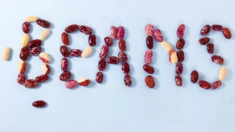 The ripened string beans move along the surface and line up in the word BEANS Stock Footage 161416448