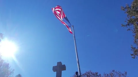 Ripped American Flag Flapping and Cross -sunbeams- (4K) Stock Footage 304474916