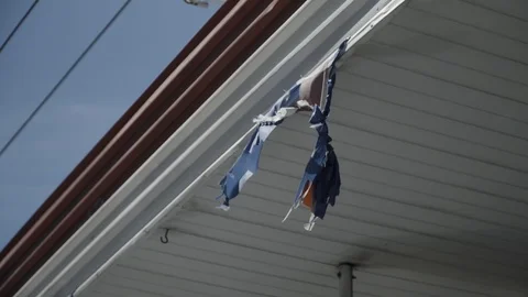 Ripped Flag Blowing in the Wind Stock Footage 89748324