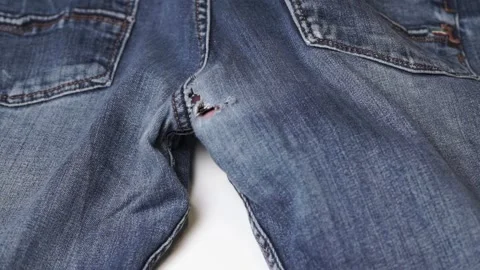 Ripped jeans on buttocks close up. Blue jeans background and texture Stock Footage 284746986