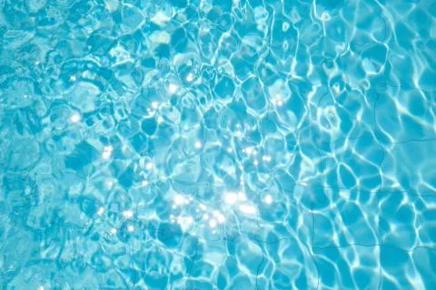 Ripped water in swimming pool .surface of blue swimming pool,background of wa Stock Photos