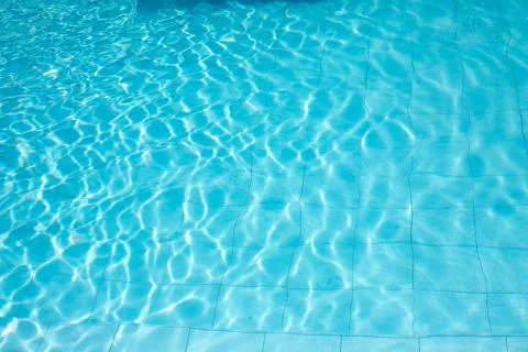 Ripped water in swimming pool .surface of blue swimming pool,background of wa Stock Photos