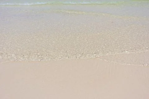 Ripple of the sea on the sandy beach Stock Photos