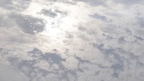 Ripple Water, Reflection of Cloud Sky in Stagnant Water after Raining Stock Footage 128678824