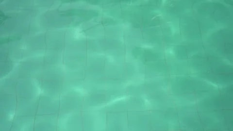 Ripple Water in swimming pool with sun reflection Stock Footage 296489683