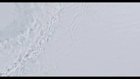 Ripple water on white background Stock Footage 256083737