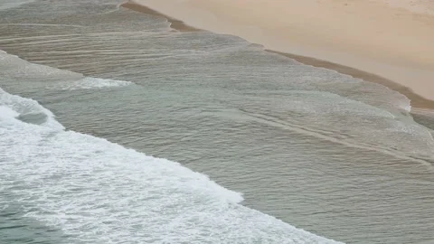 Ripple wave hit sand beach background at day time Stock Footage 132472406