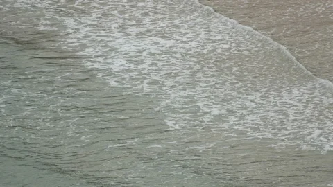 Ripple wave hit sand beach background at day time Stock Footage 132472430