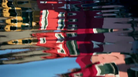 Ripple waves with red houses reflection 스톡 동영상 23980065