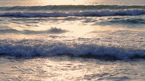 Ripple waves. Sea waves shining on sunrise sun, 4k video Stock Footage 150242472